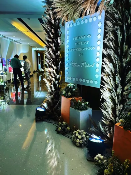 A sophisticated welcome signage for a First Holy Communion event. We used dried pampas grass and soft white flowers to create a modern and tasteful entrance arch, showing our versatility for different religious milestones.