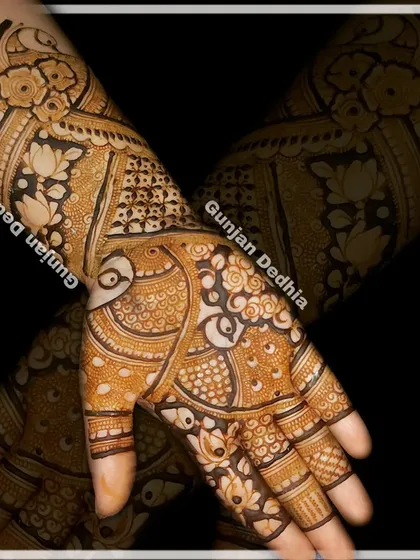 A gorgeous design for a client, featuring crossed hands to show the full pattern. The mix of peacocks, lotuses, and geometric fills is a classic combination.