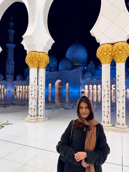 A nighttime shot at the Sheikh Zayed Grand Mosque. The magnificent structure is beautifully illuminated after dark, creating a completely different and equally breathtaking atmosphere.