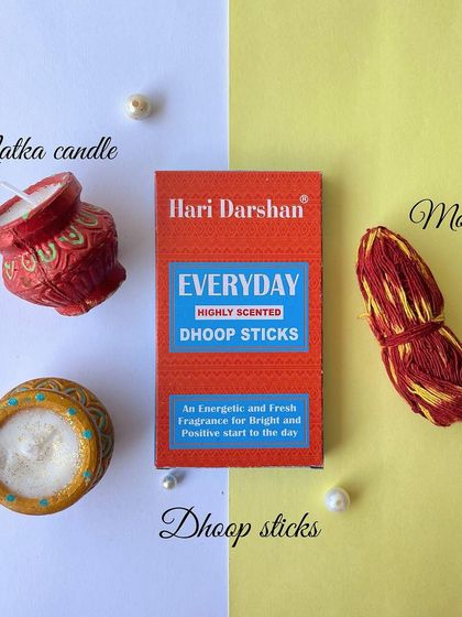 Some of the traditional items included in our Diwali hamper: matka candles, dhoop sticks, and moli thread.