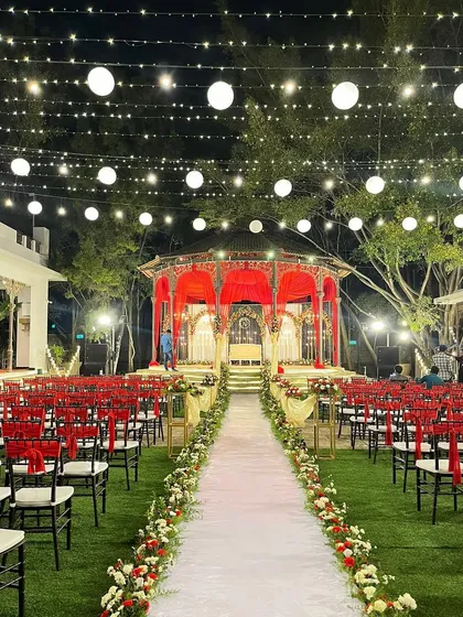 The full setup for a beautiful reception at The Tamarind Tree, showcasing the elegant lighting and seating arrangement.