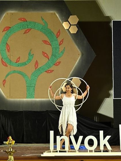 A photo from my performance at InvokED 2024, where I used my art to amplify voices and ignite movements for empowerment.