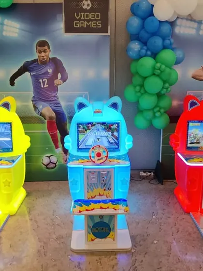 We offer a variety of kid-friendly video game cabinets. This setup includes bike and car racing simulators and a shooting gallery game, all designed with bright colors and simple controls to keep younger guests entertained for hours.