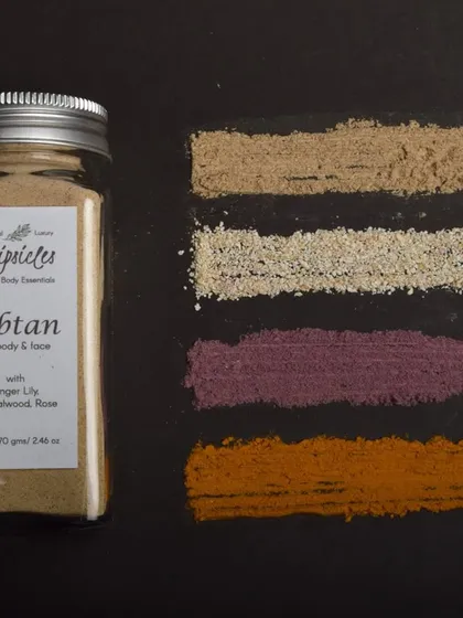 A swatch of the herbal powders that go into our Ubtan, including Ginger Lily, White Turmeric, Sandalwood, and Rose Powder.