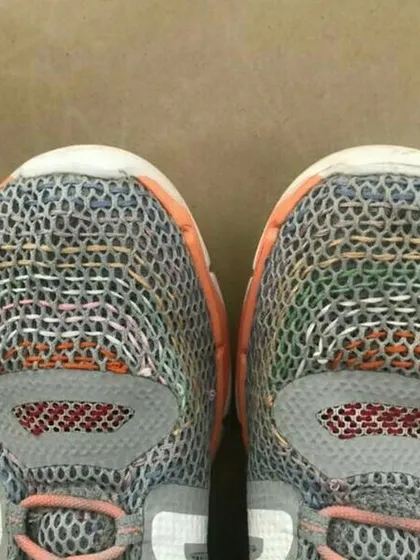 A beautiful example of visible mending on a pair of running shoes. We teach kids that repairs do not have to be invisible; they can be a creative expression that adds character and tells a story.