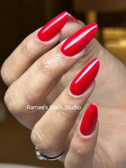 A still image of the perfect, bold red manicure. This color and shape is timeless and suits every occasion.