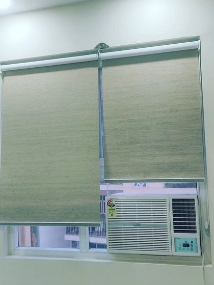 Another example of fabric roller blinds, which are a practical solution for covering windows of any size. I ensure they are measured and fitted correctly for smooth operation.