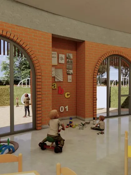 The kindergarten classroom opens directly into a sensory garden. I designed this with large arched windows to connect indoor learning with outdoor play, using natural textures like brick and mud plaster.