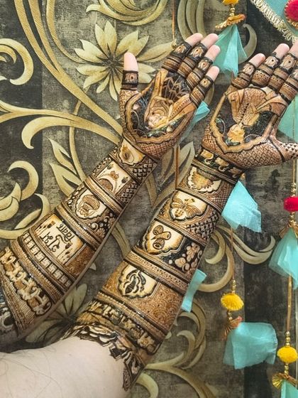 A bride admiring her detailed mehndi. My team works hard to ensure every client is delighted with their design.