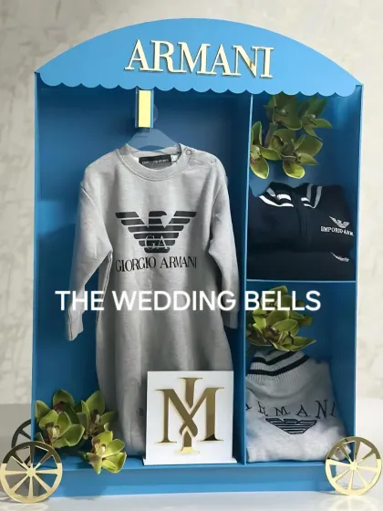 This luxurious baby wardrobe was designed for a little Armani baby. The blue chariot design with gold accents creates a royal and elegant look.