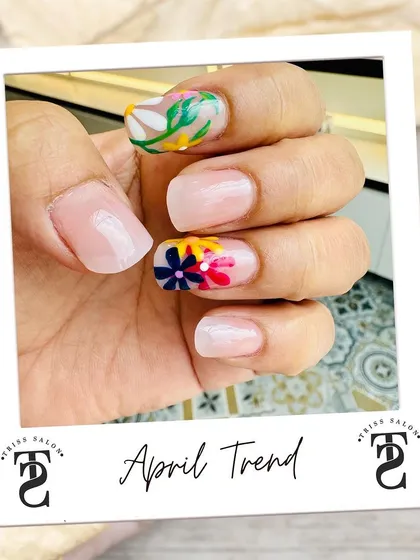 Here is a beautiful example of my detailed hand-painted nail art. This design features delicate, colorful flowers on a neutral base, creating a fresh and trendy look perfect for any season. If you have an idea, I can bring it to life.