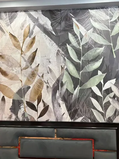 This bedroom installation combines a modern leaf pattern with a textured wall panel. The split-tone design creates a unique and artistic focal point behind the bed, blending natural and contemporary styles.