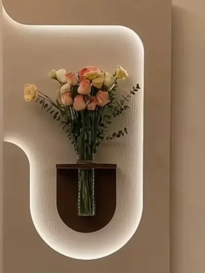 A beautiful wall-mounted vase with integrated backlighting, turning a simple flower arrangement into a stunning decor piece.
