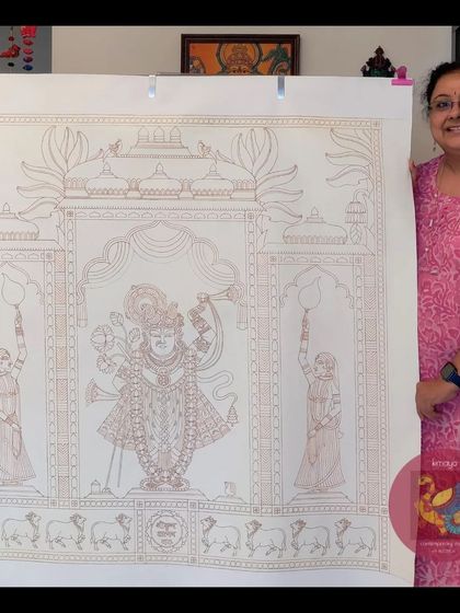 Me, standing proudly with the massive 3.5x3.5 feet canvas after completing the brown outline for the Srinathji painting. It's ready for color!