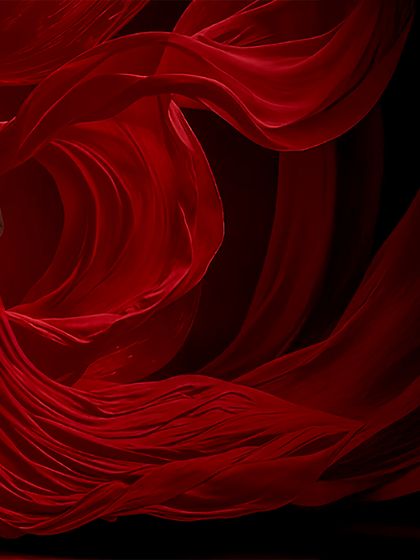 A panoramic version of the flowing red fabric shoot, showing the incredible scale and artistry involved in creating these dynamic studio portraits.