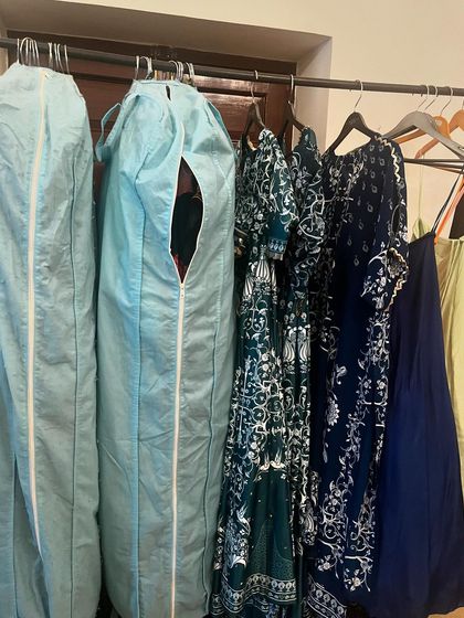 A clothing rack on set, filled with beautiful garments ready for the shoot. This is where the creative vision starts to take physical form.