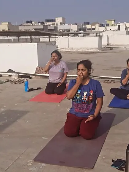 There's nothing like an early morning, open-air session. Here, my students and I are practicing pranayama, or breathwork, on a rooftop in Bangalore. This practice is incredible for improving respiratory health and calming the mind.