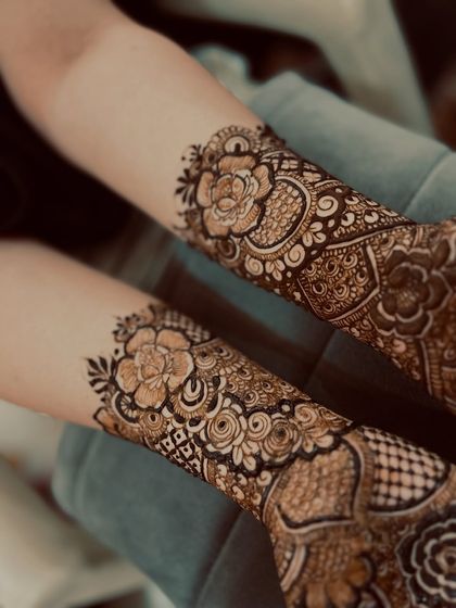 A side view of the design, highlighting the beautiful floral cuff at the wrist.