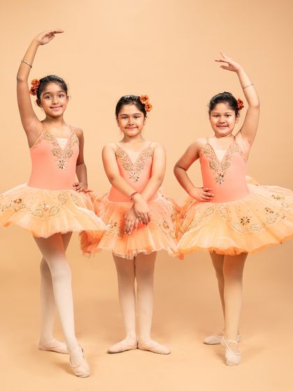 Our dancers are ready to grace the stage in 'The Waltz of the Flowers.' These photos capture their excitement and poise before bringing this timeless piece from The Nutcracker to life.