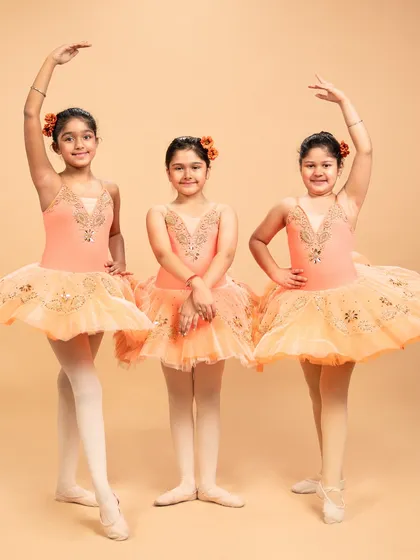 Our dancers are ready to grace the stage in 'The Waltz of the Flowers.' These photos capture their excitement and poise before bringing this timeless piece from The Nutcracker to life.