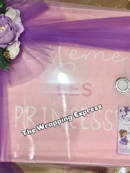 A beautifully wrapped gift box with a 'Little Princess' theme, finished with a large purple bow and a custom thank you card.
