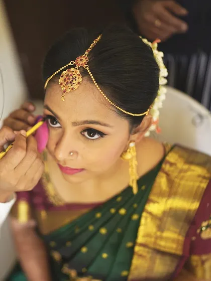 A behind the scenes shot of me giving the final touches to the eye makeup. Precision is key for that perfect, captivating look.