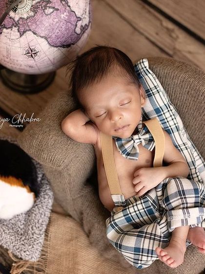 This little dude has the most chilled-out vibe, napping next to his puppy. The setup tells a story of travel, companionship, and peaceful dreams.