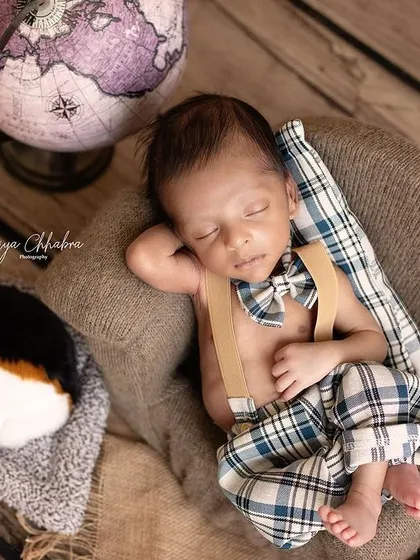 This little dude has the most chilled-out vibe, napping next to his puppy. The setup tells a story of travel, companionship, and peaceful dreams.