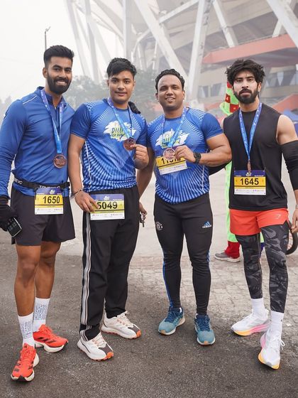 A close-up of some of our runners with their hard-earned medals from the Dilli 10K run.