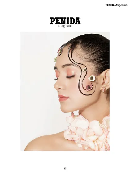 A serene profile from the floral editorial. The soft pink eyeshadow and clean skin allow the artistic hair and floral details to stand out.