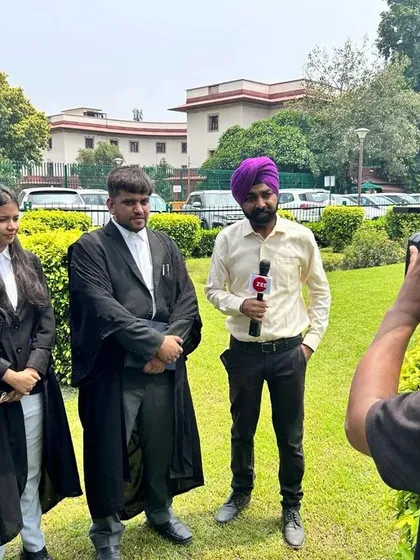 Engaging with the media outside the Supreme Court, providing context and updates on a significant public interest litigation.