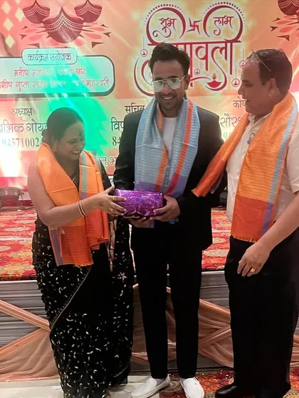 Receiving a gift as a token of appreciation from the members of the council.
