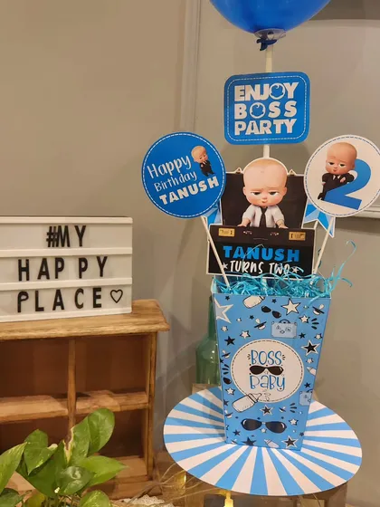 It's all in the small details! A themed centerpiece next to our "My Happy Place" sign.
