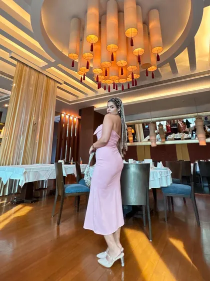A dramatic pose in a beautiful restaurant. The lighting was too good not to capture this look.