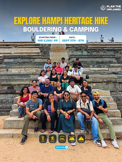 Our group posing on the steps of a historic structure in Hampi. This trip combines heritage exploration with adventure activities like bouldering and camping.