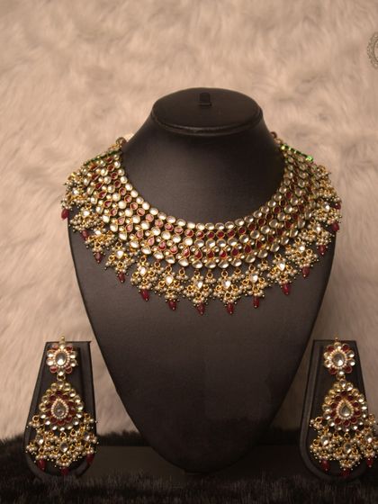 Rent this evergreen red and white Kundan necklace set for your special occasion. It’s a classic bridal choice that never goes out of style and is available for a fraction of the cost.