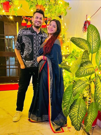 A Diwali picture with my husband. My simple cotton saree is comfortable for hosting and celebrating at home, while still looking festive.