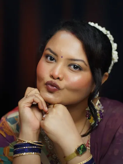 A playful pout, showing off a festive glam look that you can master in my self-grooming class.