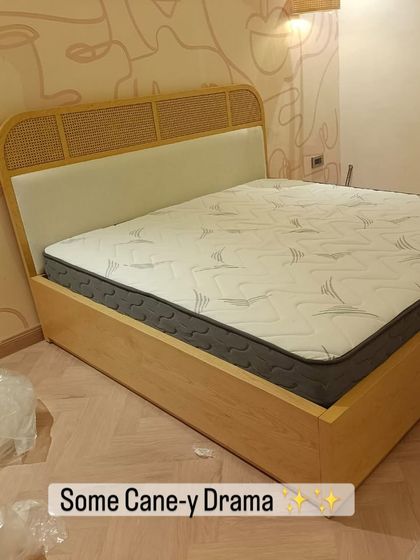 I love adding natural textures like cane to my designs. This bed features a headboard with woven cane panels and a light wood frame, perfect for a breezy, contemporary bedroom.