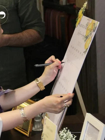 A guest signing a due-date calendar, another fun and interactive way for friends and family to share in the excitement.