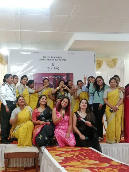 A group photo with the amazing staff and guests at the Tanishq Women's Day event. It's a team effort to create a successful brand promotion, and I love celebrating with everyone involved.