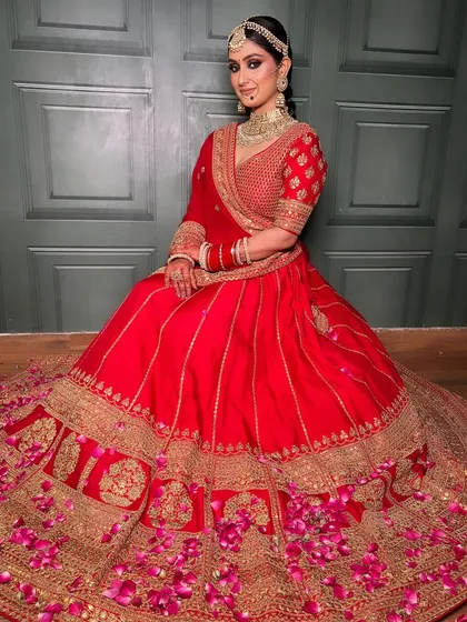 Another beautiful shot of this bride, looking serene and regal. The way the lehenga spreads out creates a truly royal portrait.