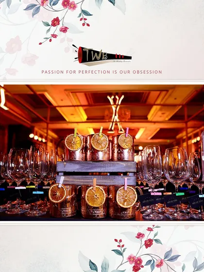 A stylish arrangement of copper mugs with dehydrated orange garnishes for a corporate anniversary event.