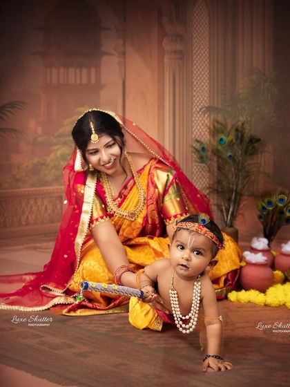 Capturing a dynamic moment with a crawling Bal Krishna and his loving Maiyya. We photograph children at all stages, embracing their natural movement.