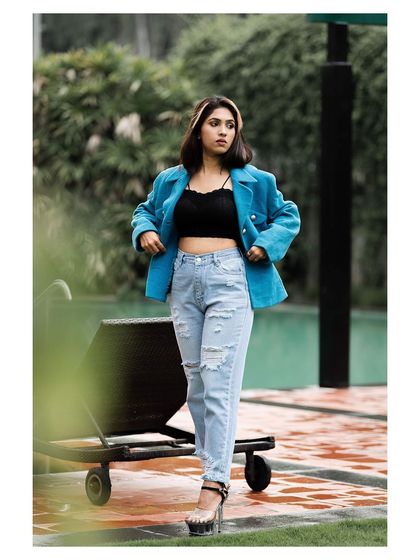 A full-length view of the outfit, showing the platform heels and the overall styling.