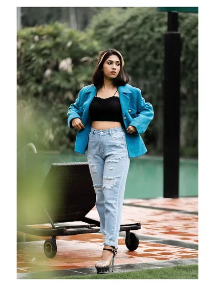A full-length view of the outfit, showing the platform heels and the overall styling.
