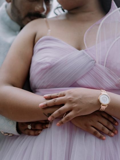 An intimate close-up showing the delicate details of our lilac 'Gorgina' gown. The one-shoulder design with its structured floral element is both modern and romantic.