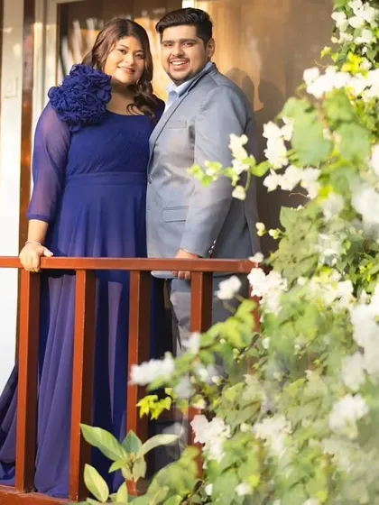 A simple yet elegant blue gown paired with a grey suit makes for a timeless couple's portrait.