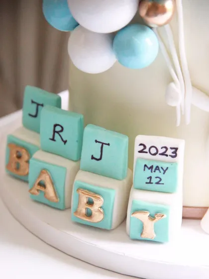 A detail shot of the personalized baby blocks, a sweet touch to commemorate the special day.
