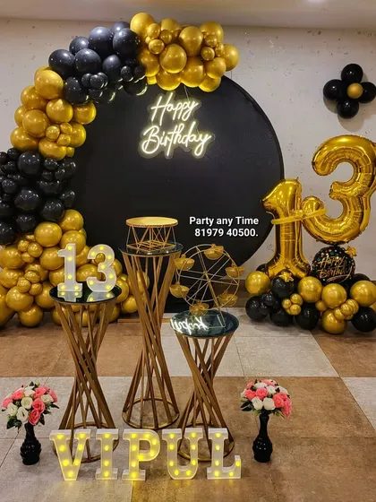 For a stylish teen or adult party, I designed this black and gold theme for a 13th birthday. It features a round black backdrop, a neon "Happy Birthday" sign, a dramatic balloon arch, and matching gold plinths and marquee numbers.